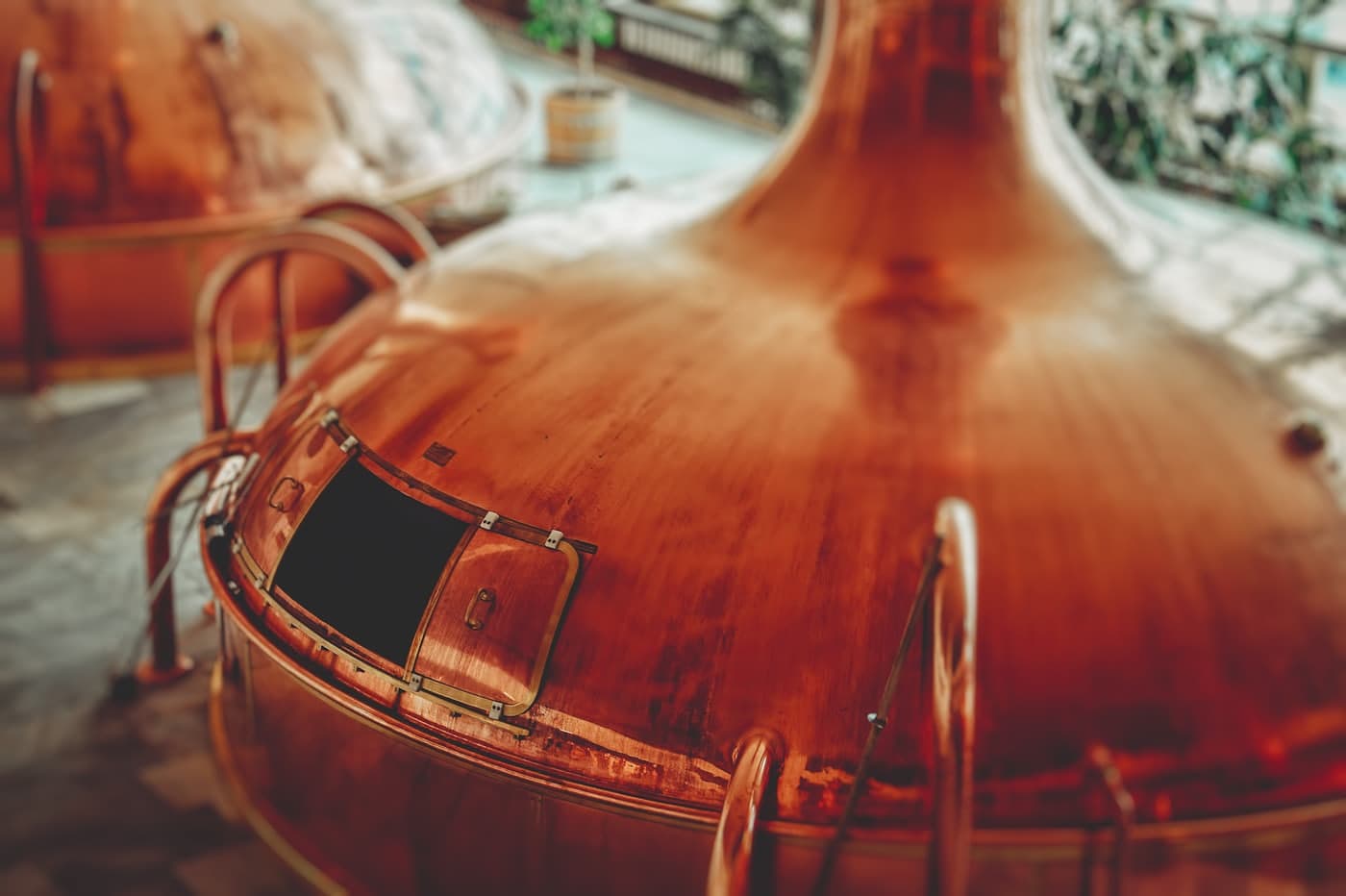 The domed top of a copper pot still, close up